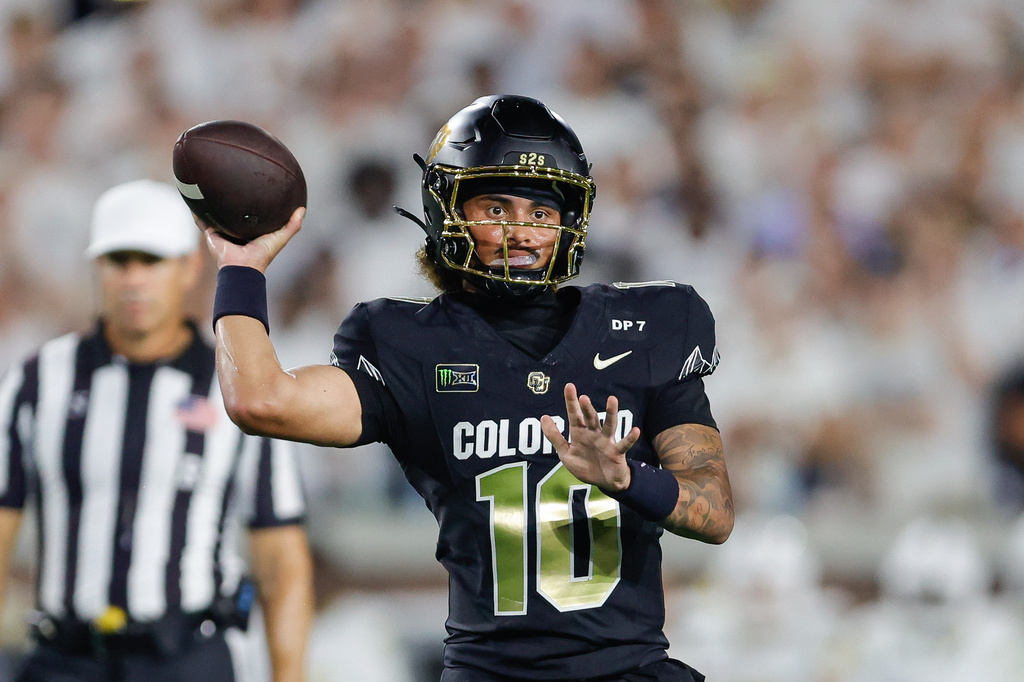 FILE - Colorado quarterback Julian Lewis (10) passes the ball during an NCAA college football game against Georgia Tech in Atlanta, Sept. 3, 2026. (AP Photo/Stew Milne, File)