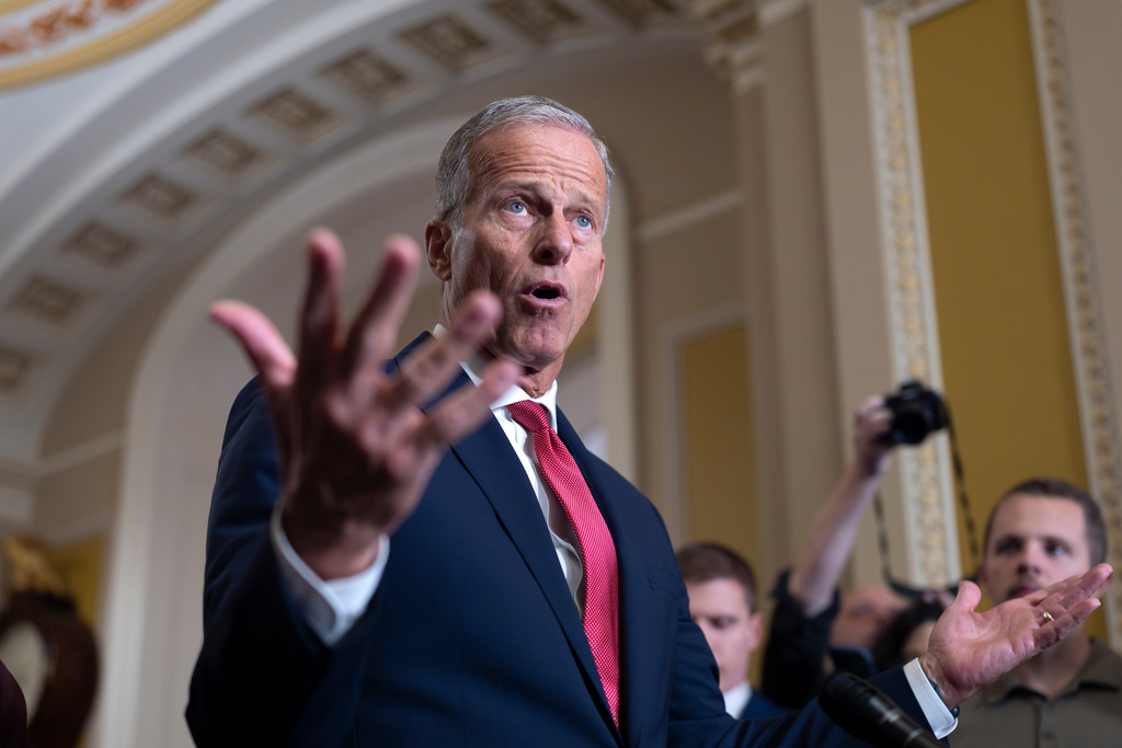 Senate Majority Leader John Thune, R-S.D., gestures while speaking with reporters as the government lurches toward a shutdown at the Capitol in Washington, Tuesday, Sept. 30, 2025. (AP Photo/J. Scott Applewhite)