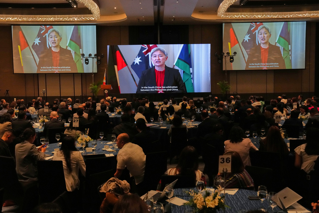 Australian Foreign Minister Penny Wong speaks in a videotaped message to mark the 10th anniversary of a 2016 arbitration ruling which invalidated China's expansive claims in the disputed South China Sea during a conferene in Manila, Philippines on Friday, July 10, 2026. (AP Photo/Aaron Favila)