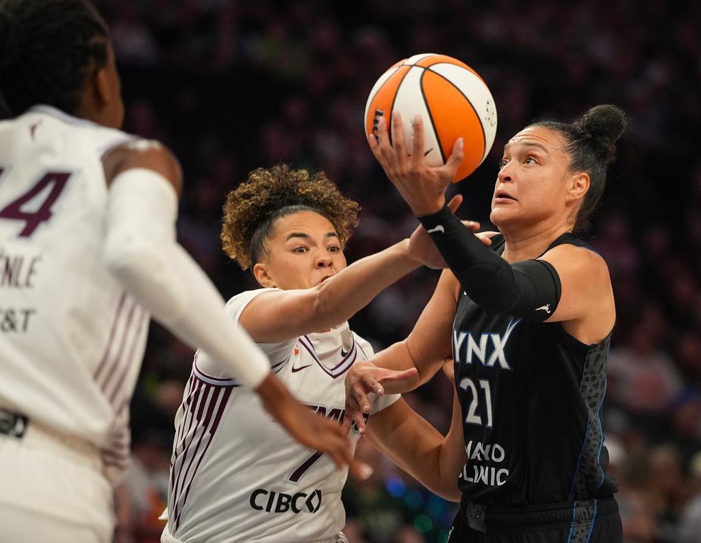 Minnesota Lynx guard Kayla McBride (21) is fouled by Toronto Tempo guard Kiki Rice (1) in the first quarter of a WNBA basketball game Tuesday, July 28, 2026, in Minneapolis. (Jeff Wheeler/Minnesota Star Tribune via AP)