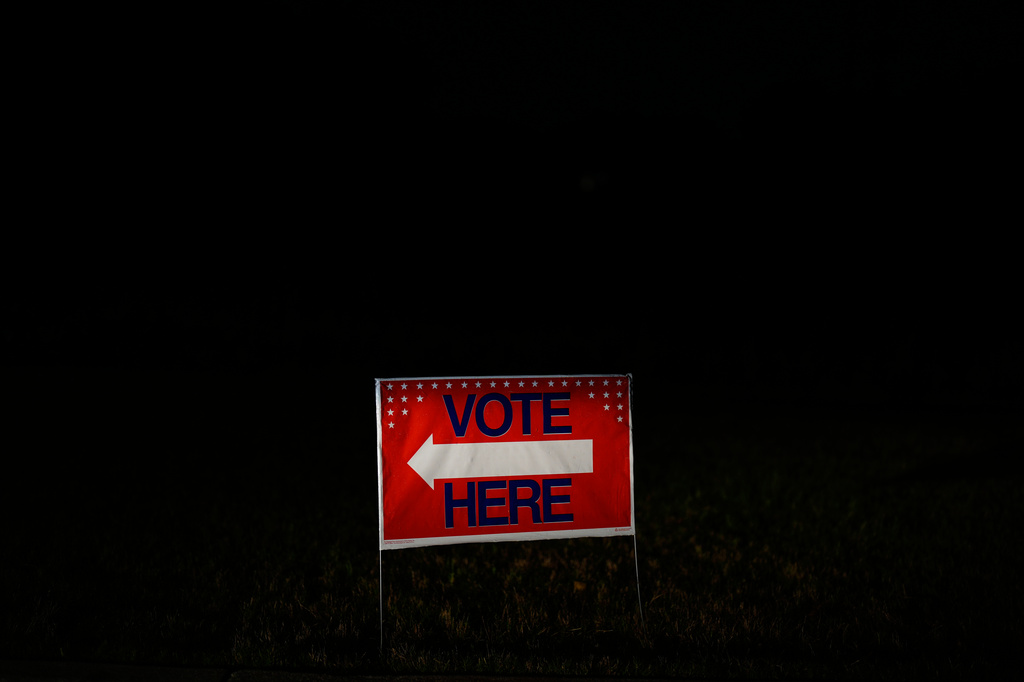 A vote here sign points to where people will vote on Tuesday, May 19, 2026, in Atlanta. (AP Photo/Brynn Anderson)