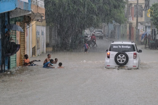 Children play in a street flooded by rains caused by Tropical Storm Melissa in Santo Domingo, Dominican Republic, Friday, Oct. 24, 2025. (AP Photo/Ricardo Hernandez) Children play in a street flooded by rains caused by Tropical Storm Melissa in Santo Domingo, Dominican Republic, Friday, Oct. 24, 2025. (AP Photo/Ricardo Hernandez)