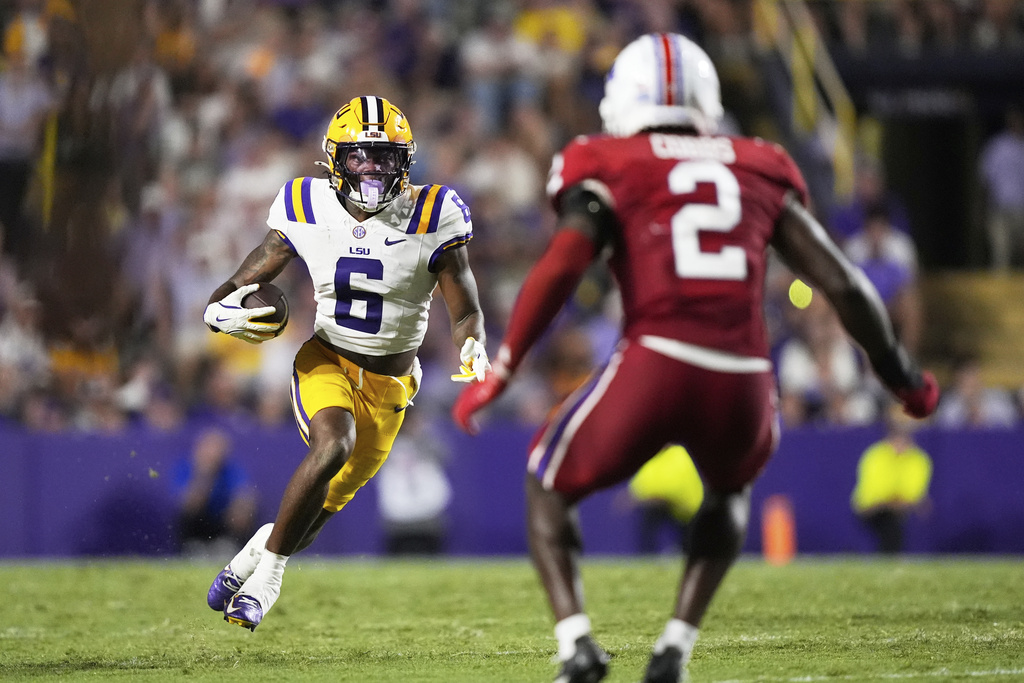 LSU wide receiver Barion Brown (6) carries against Louisiana Tech defensive back Joshua Cobbs (2) in the second half of an NCAA college football game Saturday, Sept. 6, 2025, in Baton Rouge, La. (AP Photo/Gerald Herbert)