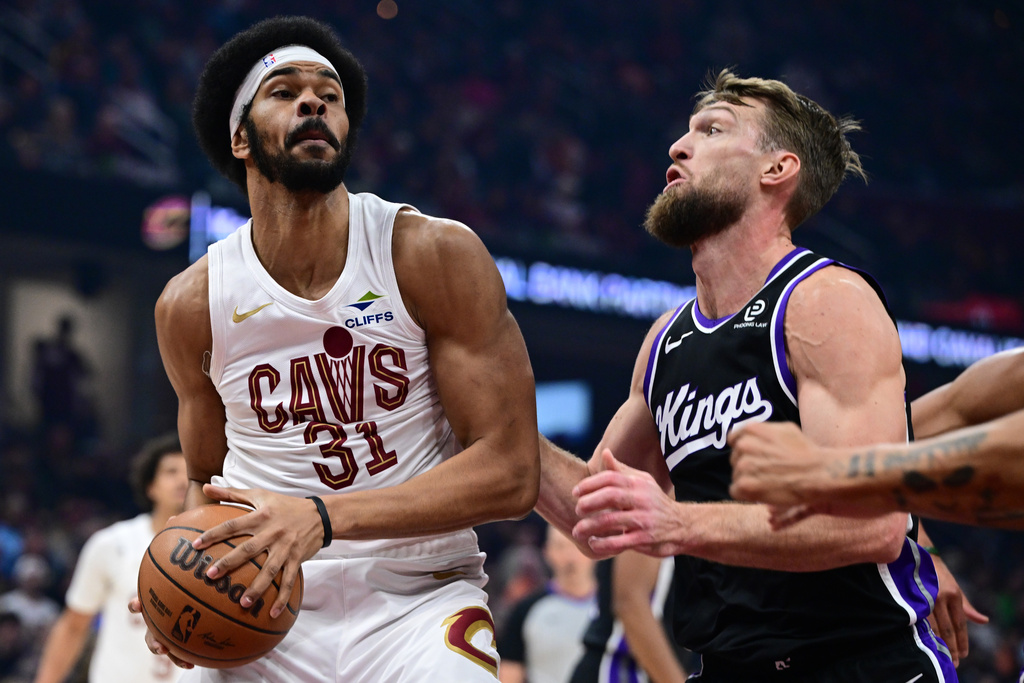 Cleveland Cavaliers center Jarrett Allen (31) goes to the basket against Sacramento Kings forward Domantas Sabonis in the first half of an NBA basketball game, Friday, Jan. 23, 2026, in Cleveland. (AP Photo/David Dermer)