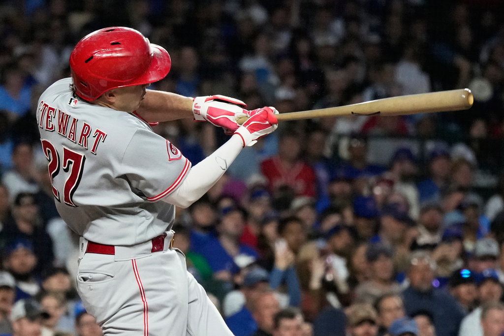 Cincinnati Reds' Sal Stewart hits a single during the first inning of a baseball game against the Chicago Cubs in Chicago, Monday, May 4, 2026. (AP Photo/Nam Y. Huh)