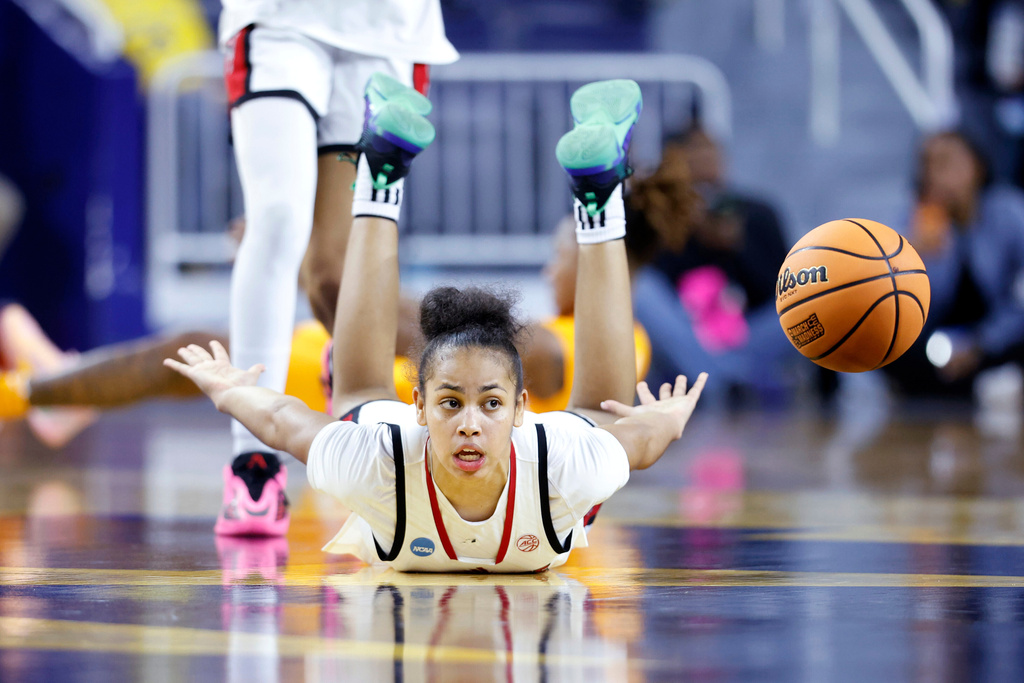 North Carolina State guard Zamareya Jones hits the floor after diving for the ball during the second half against Tennessee in the first round of the NCAA college basketball tournament, Friday, March 20, 2026, in Ann Arbor, Mich. (AP Photo/Al Goldis)