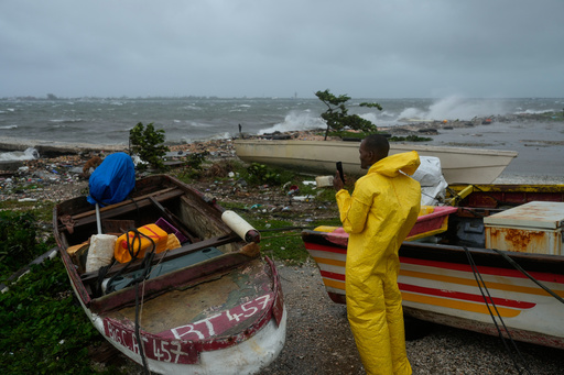A man watches the coastline in Kingston, Jamaica, as Hurricane Melissa closes in, Tuesday, Oct. 28, 2025. (AP Photo/Matias Delacroix) A man watches the coastline in Kingston, Jamaica, as Hurricane Melissa closes in, Tuesday, Oct. 28, 2025. (AP Photo/Matias Delacroix)