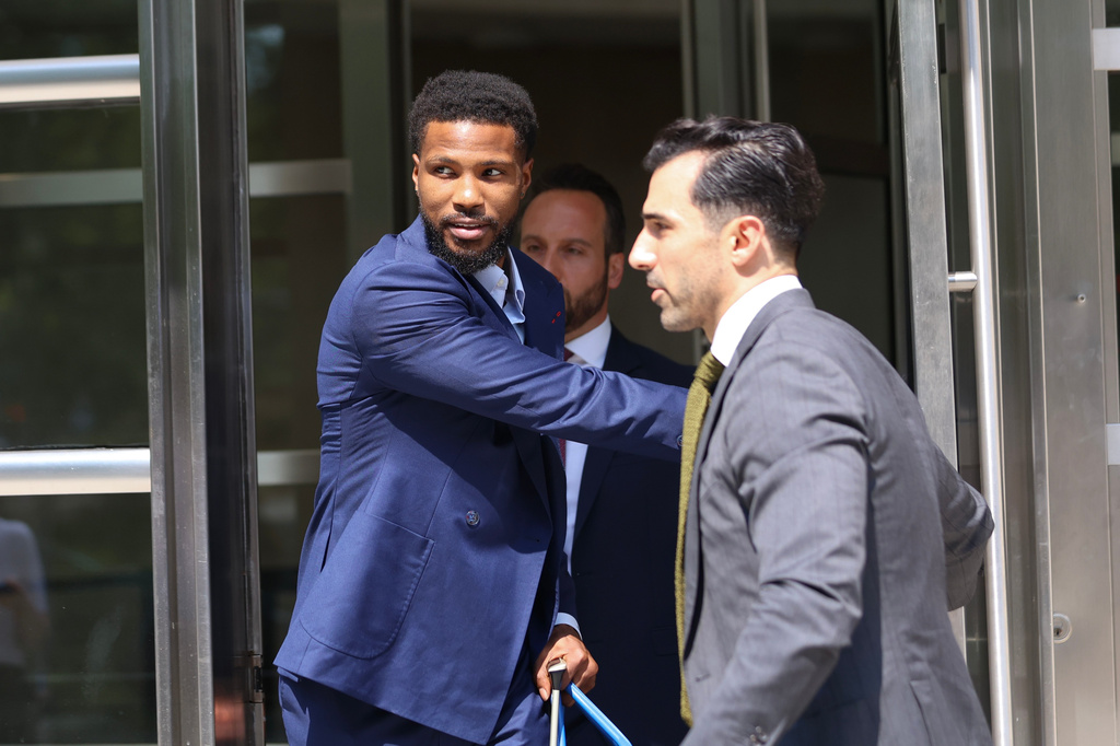 Former NBA player Malik Beasley, center, exits Brooklyn federal court, Wednesday, July 1, 2026, in New York. (AP Photo/Heather Khalifa) CORRECTION: name of the photographer corrected to Heather Khalifa instead of Yuki Iwamura