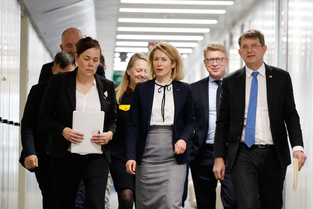 European Union foreign policy chief Kaja Kallas, center, walks with Minister for Foreign Affairs and Research of Greenland Vivian Motzfeldt, front left, and Denmark's Defense Minister Troels Lund Poulsen, front right, prior to a meeting at EU headquarters in Brussels, Monday, Jan. 19, 2026. (AP Photo/Geert Vanden Wijngaert)