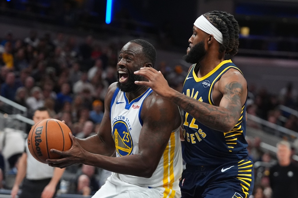 Golden State Warriors' Draymond Green (23) is fouled by Indiana Pacers' Isaiah Jackson (22) during the first half of an NBA basketball game, Saturday, Nov. 1, 2025, in Indianapolis. (AP Photo/Darron Cummings)