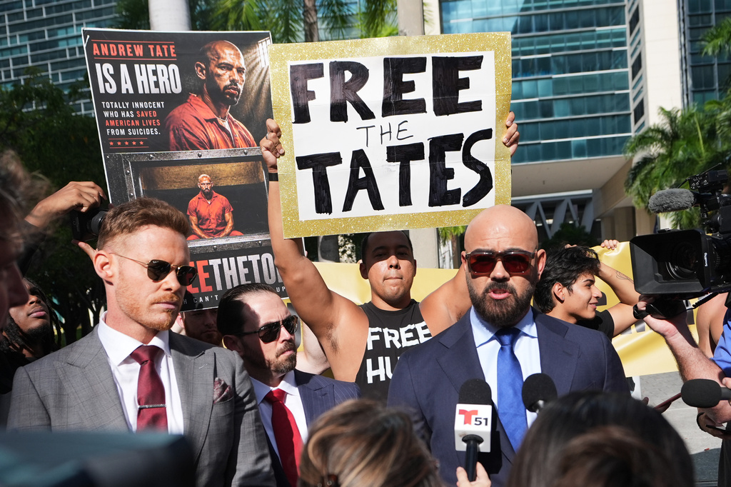 Attorney Joseph McBride, right, who represents Andrew and Tristan Tate as they fight extradition to the United Kingdom on charges of rape and sex trafficking, speaks to the news media before a bond hearing at the C. Clyde Atkins U.S. Courthouse in Miami, Thursday, Aug. 27, 2026. (AP Photo/Lynne Sladky)