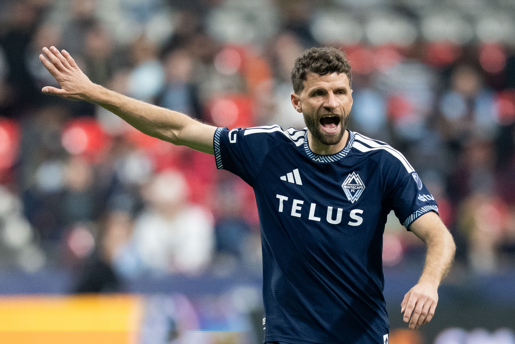 Vancouver Whitecaps' Thomas Muller (13) yells to his teammates during the first half of an MLS soccer match against Real Salt Lake in Vancouver, on Saturday, Feb. 21, 2026. (Ethan Cairns/The Canadian Press via AP)