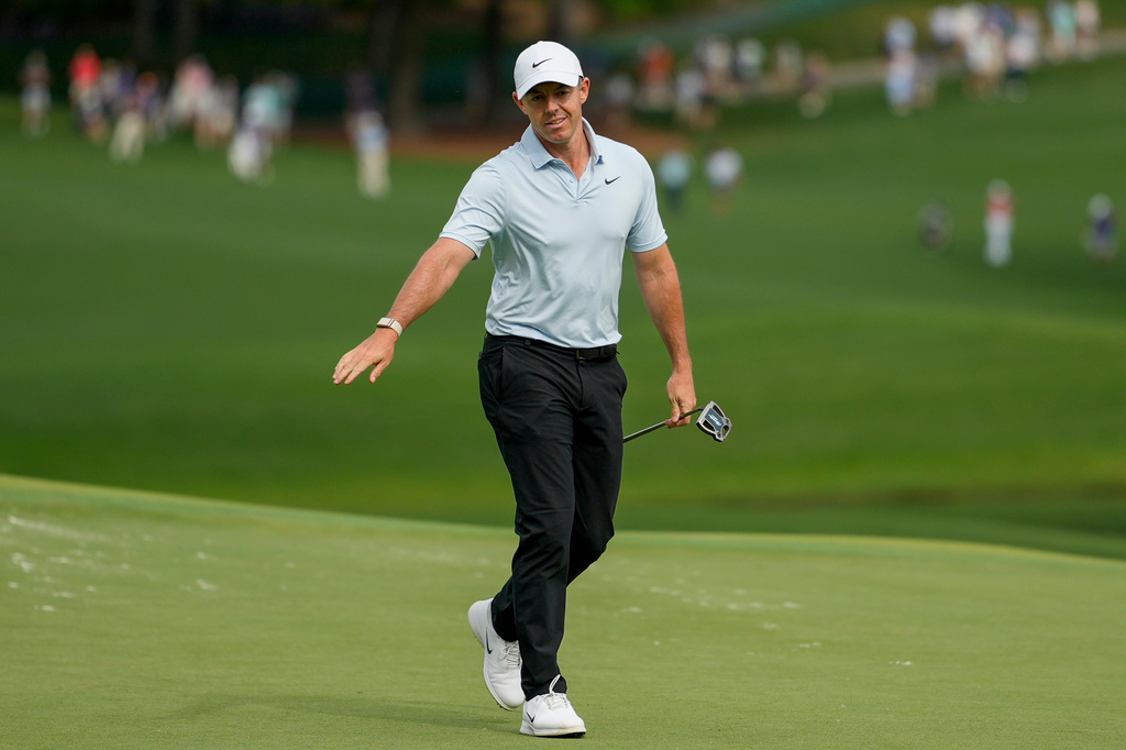 Rory McIlroy, of Northern Ireland, follows his shot on the 15th green during second round of the Truist Championship golf tournament at the Quail Hollow Club, Friday, May 8, 2026, in Charlotte, N.C. (AP Photo/Chris Carlson)