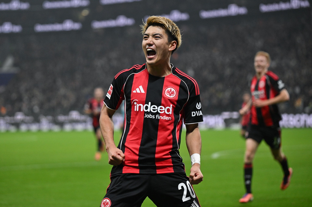 Frankfurt's Ritsu Doan celebrates after scoring during the German Bundesliga soccer match between Eintracht Frankfurt and FSV Mainz 05 in Frankfurt, Germany, Sunday, Nov. 9, 2025. (Arne Dedert/dpa via AP)