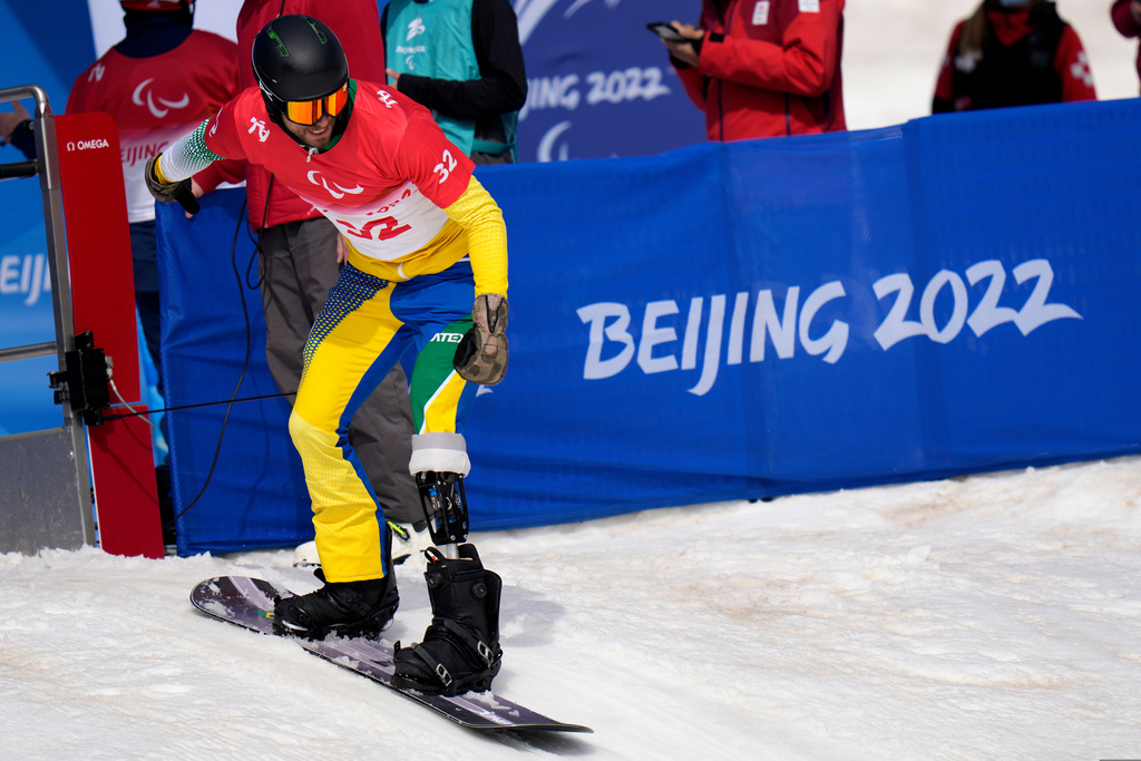 FILE - A Brazilan athlete starts during a training session ahead of Friday's para snowboard event at the 2022 Winter Paralympics, Thursday, March 10, 2022, in Zhangjiakou, China. (AP Photo/Shuji Kajiama, file)