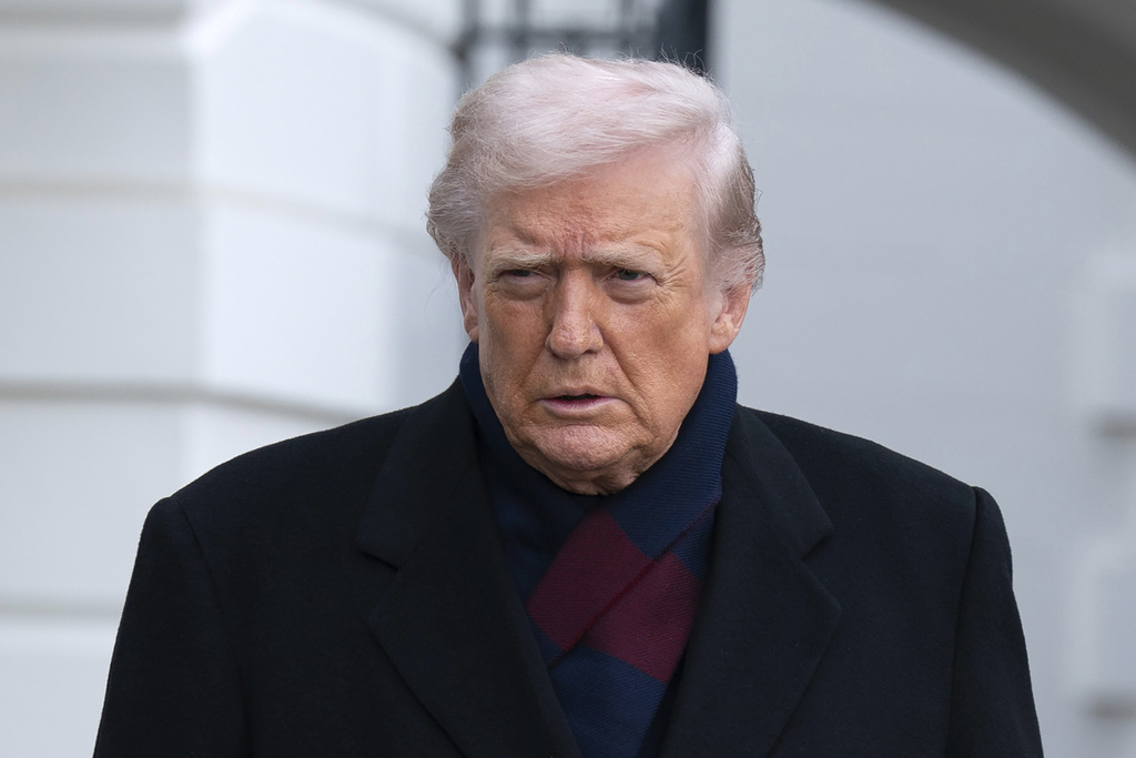 President Donald Trump talks to reporters as he departs from the South Lawn of the White House, Saturday, Dec. 13, 2025, in Washington, en route to Baltimore to attend the Army-Navy football game. (AP Photo/Jose Luis Magana)