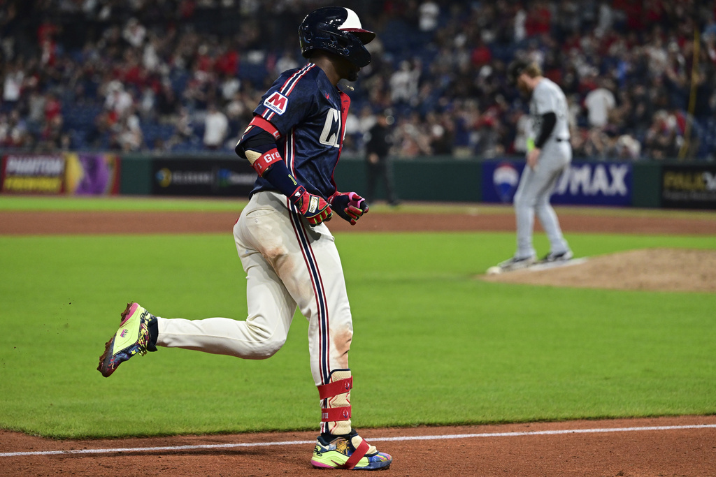 Cleveland Guardians' Angel Martinez runs the bases after hitting a solo home run off Chicago White Sox relief pitcher Steven Wilson during the eighth inning of a baseball game, Friday, Sept. 12, 2025, in Cleveland. (AP Photo/David Dermer)