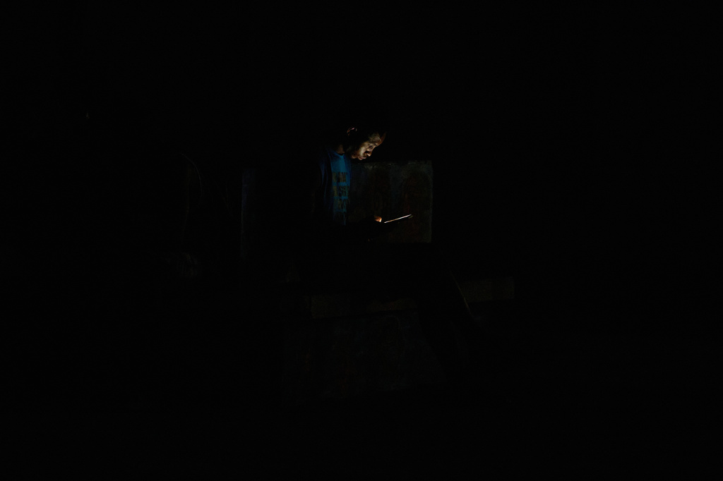A man looks at his cell phone during a blackout in Havana, Cuba, Monday, July 6, 2026. (AP Photo/Ramon Espinosa)