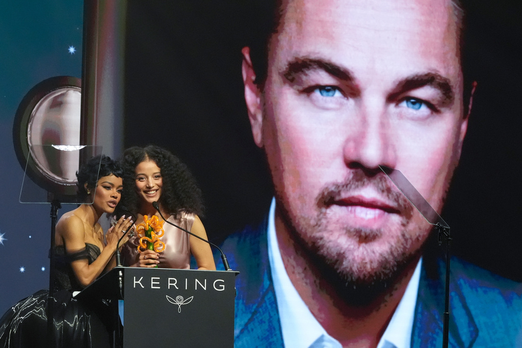 Teyana Taylor, left, and Chase Infiniti accept the desert palm achievement award on behlaf of Leonardo DiCaprio during the 37th Palm Springs International Film Festival Film Awards on Saturday, Jan. 3, 2026 at Palm Springs Convention Center in Palm Springs, Calif. (AP Photo/Chris Pizzello)