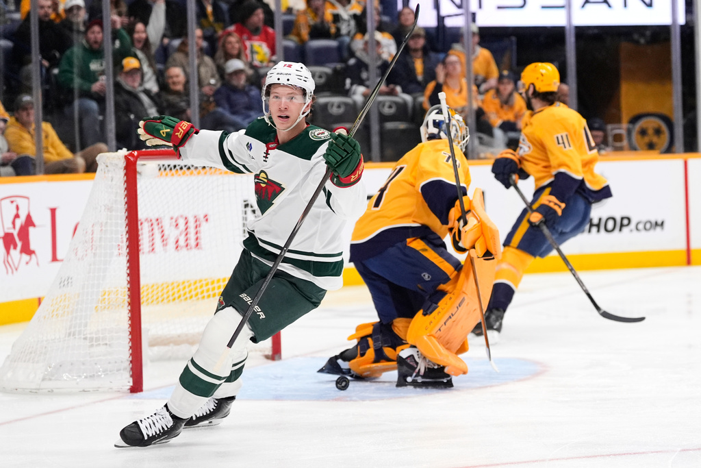 Minnesota Wild left wing Matt Boldy (12) celebrates his goal during the first period of an NHL hockey game against the Nashville Predators, Wednesday, Feb. 4, 2026, in Nashville, Tenn. (AP Photo/George Walker IV)