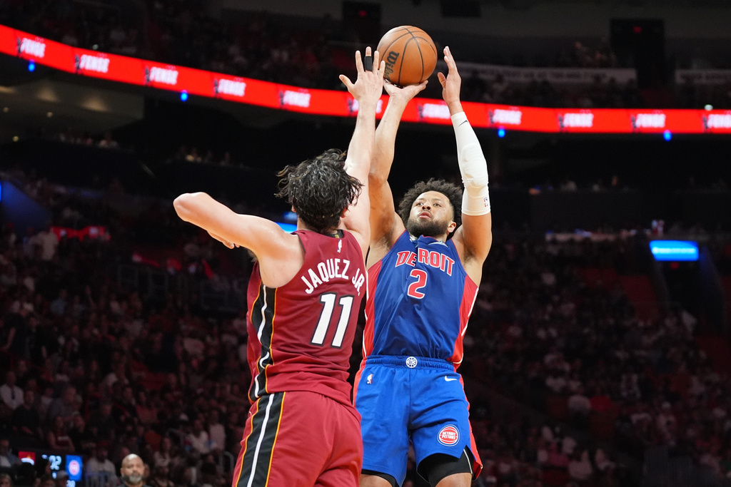 Detroit Pistons guard Cade Cunningham (2) aims to score as Miami Heat forward Jaime Jaquez Jr. (11) defends during the first half of an NBA basketball game Sunday, March 8, 2026, in Miami. (AP Photo/Marta Lavandier)
