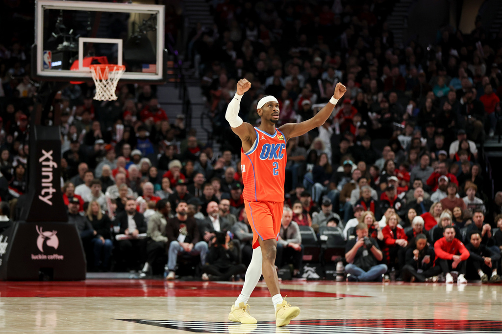 Oklahoma City Thunder guard Shai Gilgeous-Alexander (2) reacts during the second half of an NBA basketball game against the Portland Trail Blazers, Sunday, Nov. 30, 2025, in Portland, Ore. (AP Photo/Amanda Loman)