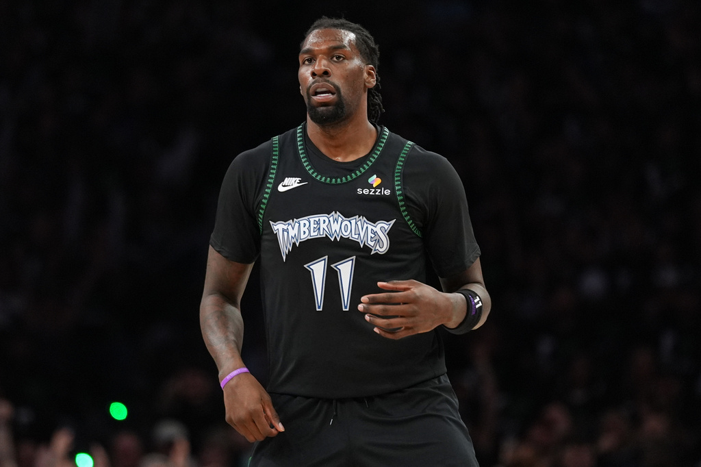 FILE - Minnesota Timberwolves center Naz Reid stands on the court during the first half of Game 3 of a NBA basketball second-round playoff series against the San Antonio Spurs, May 8, 2026, in Minneapolis. (AP Photo/Abbie Parr, file)
