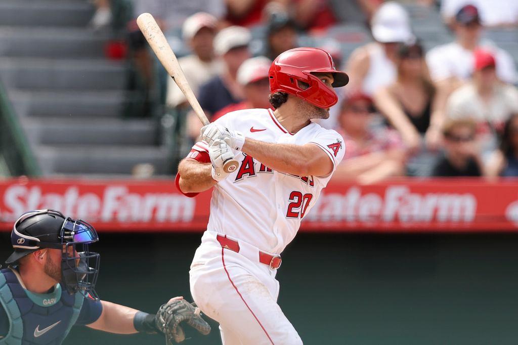Los Angeles Angels' Adam Frazier follows through on an RBI single during the fifth inning of a baseball game against the Seattle Mariners, Sunday, April 5, 2026, in Anaheim, Calif. (AP Photo/Jessie Alcheh)