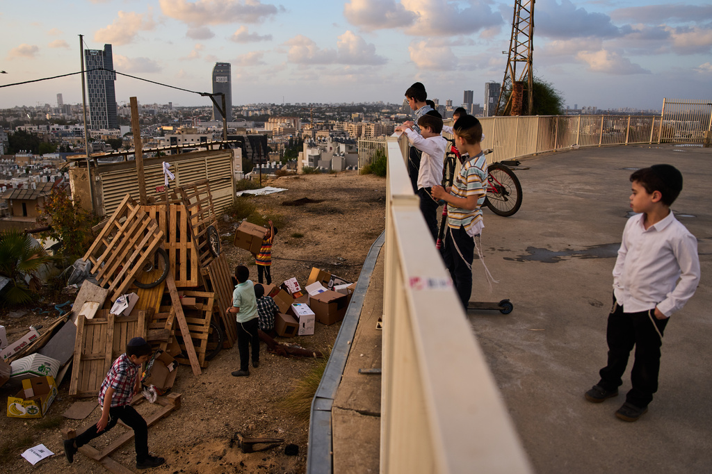 Ultra-Orthodox Jewish children build bonfires in preparation for Lag BaOmer, a Jewish holiday traditionally marked by bonfire, music, and communal celebrations, in Bnei Brak, Israel, Monday, May 4, 2026. (AP Photo/Oded Balilty)