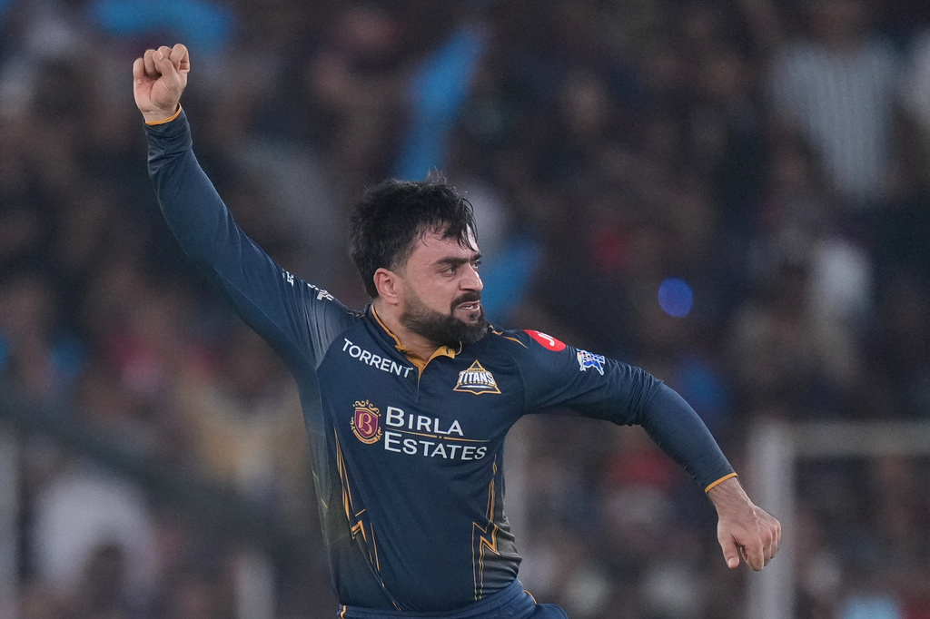 Gujarat Titans' Rashid Khan celebrates the wicket of Royal Challengers Bengaluru's Devdutt Padikkal during the Indian Premier League cricket match between Gujarat Titans and Royal Challengers Bengaluru in Ahmedabad, India, Thursday, April 30, 2026. (AP Photo/Ajit Solanki)