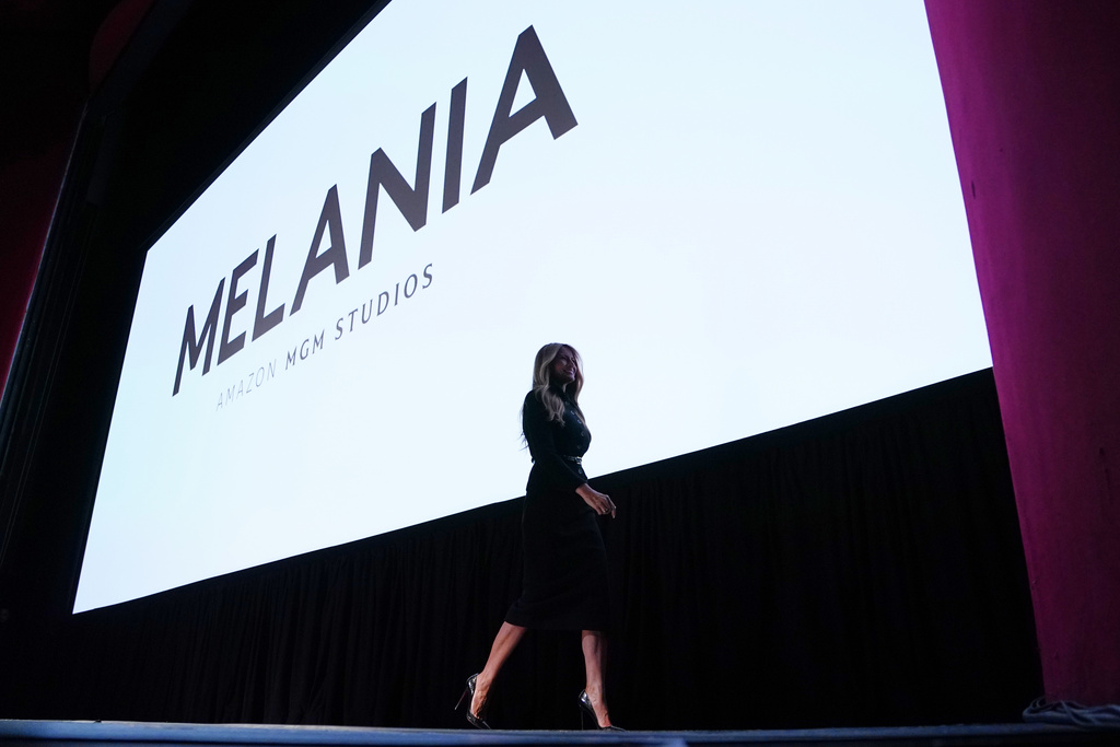 First lady Melania Trump walks from the stage after speaking before the premiere of her movie "Melania" at The John F. Kennedy Memorial Center For The Performing Arts, Thursday, Jan. 29, 2026, in Washington. (AP Photo/Allison Robbert)