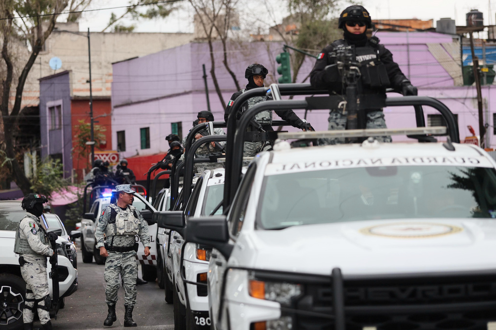National Guards patrol the area outside of the General Prosecutor's headquarters in Mexico City, Sunday, Feb. 22, 2026, after authorities reported that the Mexican Army killed Jalisco New Generation Cartel leader Nemesio Oseguera, known as "El Mencho." (AP Photo/Ginette Riquelme)