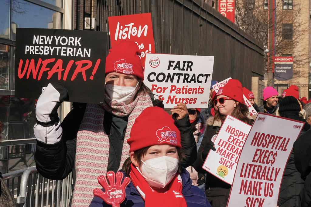 Striking nurses walk a picket line outside NewYork Presbyterian Hospital in New York, Monday, Feb. 9, 2026. (AP Photo/Richard Drew)