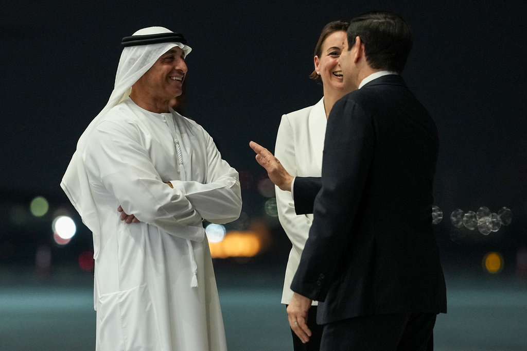 Secretary of State Marco Rubio speaks with UAE Ambassador to the U.S. Yousef Al Otaiba upon his arrival at Al Bateen Executive Airport, in Abu Dhabi, United Arab Emirates, Tuesday, June 23, 2026. (Eric Lee/Pool Photo via AP)
