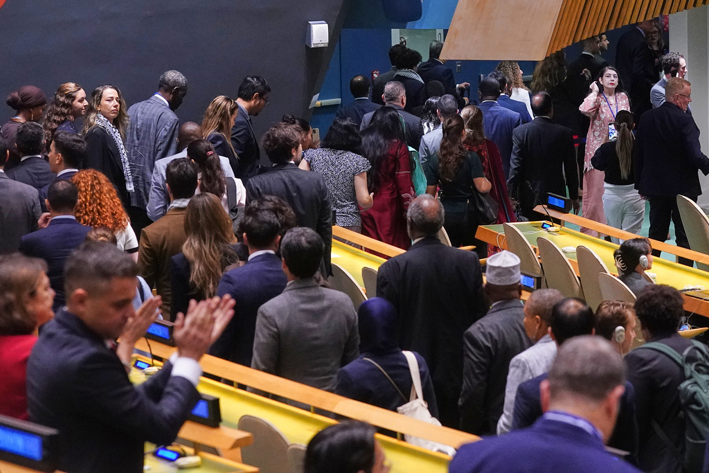 Delegates leave as Israel Prime Minister Benjamin Netanyahu arrives to address the 80th session of the United Nations General Assembly, Friday, Sept. 26, 2025. (AP Photo/Richard Drew)