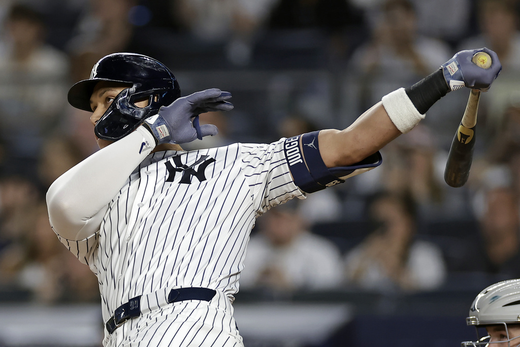 New York Yankees' Aaron Judge hits a home run during the first inning of a baseball game against the Detroit Tigers, Thursday, Sept. 11, 2025, in New York. (AP Photo/Adam Hunger)