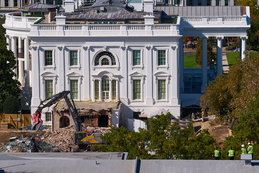 Construction workers, bottom right, atop the U.S. Treasury, watch as work continues on a largely demolished part of the East Wing of the White House, Thursday, Oct. 23, 2025, in Washington, before construction of a new ballroom. (AP Photo/Jacquelyn Martin) Construction workers, bottom right, atop the U.S. Treasury, watch as work continues on a largely demolished part of the East Wing of the White House, Thursday, Oct. 23, 2025, in Washington, before construction of a new ballroom. (AP Photo/Jacquelyn Martin)