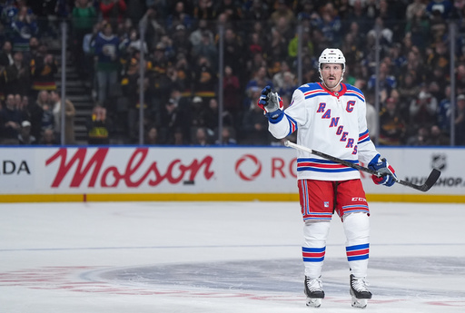 New York Rangers' J.T. Miller acknowledges a standing ovation from the crowd during the first period of an NHL hockey game against his former team, the Vancouver Canucks, in Vancouver, on Tuesday, Oct. 28, 2025. (Darryl Dyck/The Canadian Press via AP) New York Rangers' J.T. Miller acknowledges a standing ovation from the crowd during the first period of an NHL hockey game against his former team, the Vancouver Canucks, in Vancouver, on Tuesday, Oct. 28, 2025. (Darryl Dyck/The Canadian Press via AP)
