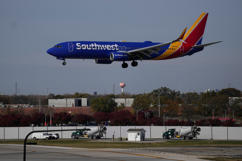 A Southwest Airlines airplane lands at Midway International Airport, Thursday, Nov. 6, 2025, in Chicago. (AP Photo/Erin Hooley)