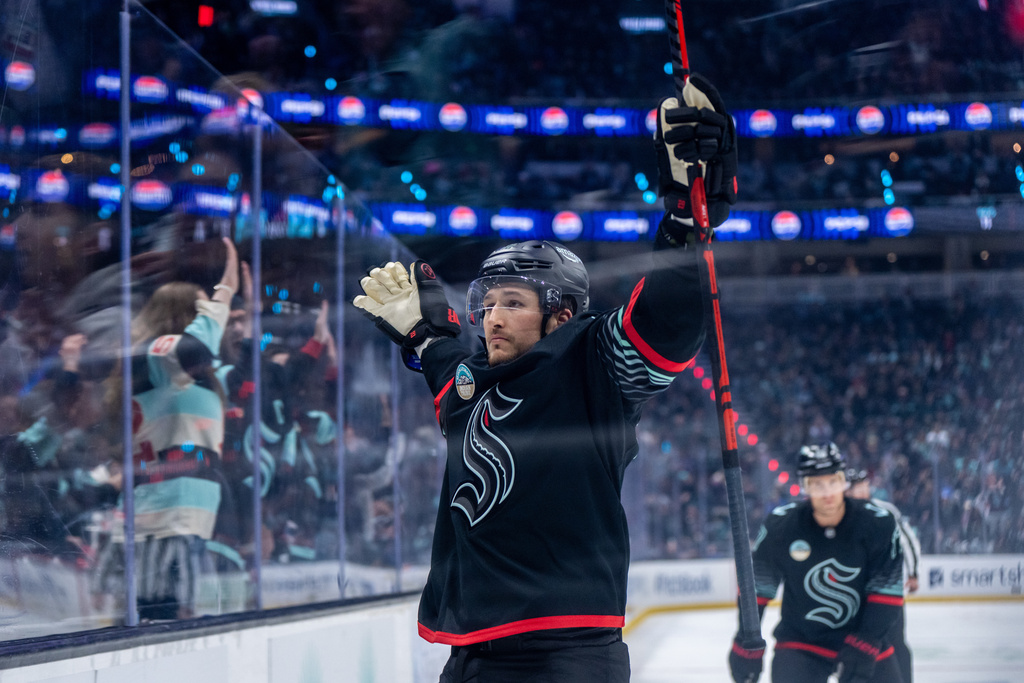 Seattle Kraken defenseman Brandon Montour celebrates after scoring a goal during the second period of an NHL hockey game against the New York Rangers, Saturday, Nov. 1, 2025, in Seattle. (AP Photo/Stephen Brashear)