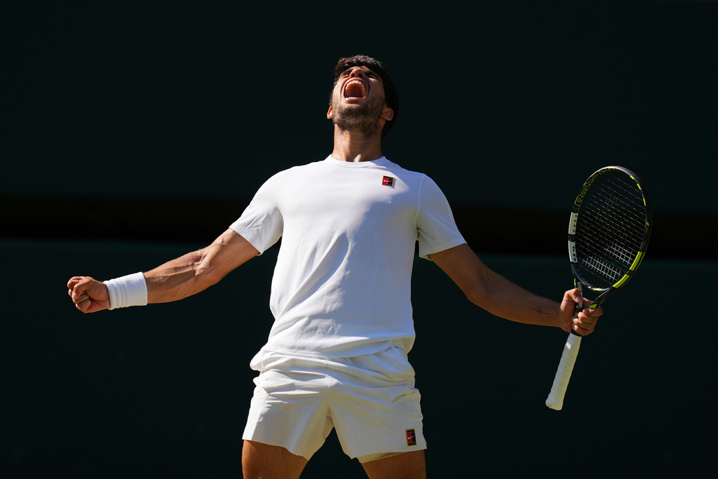 Carlos Alcaraz of Spain celebrates winning the men's semifinal singles match against Taylor Fritz of the U.S. at the Wimbledon Tennis Championships in London, July 11, 2025.(AP Photo/Kirsty Wigglesworth, File)