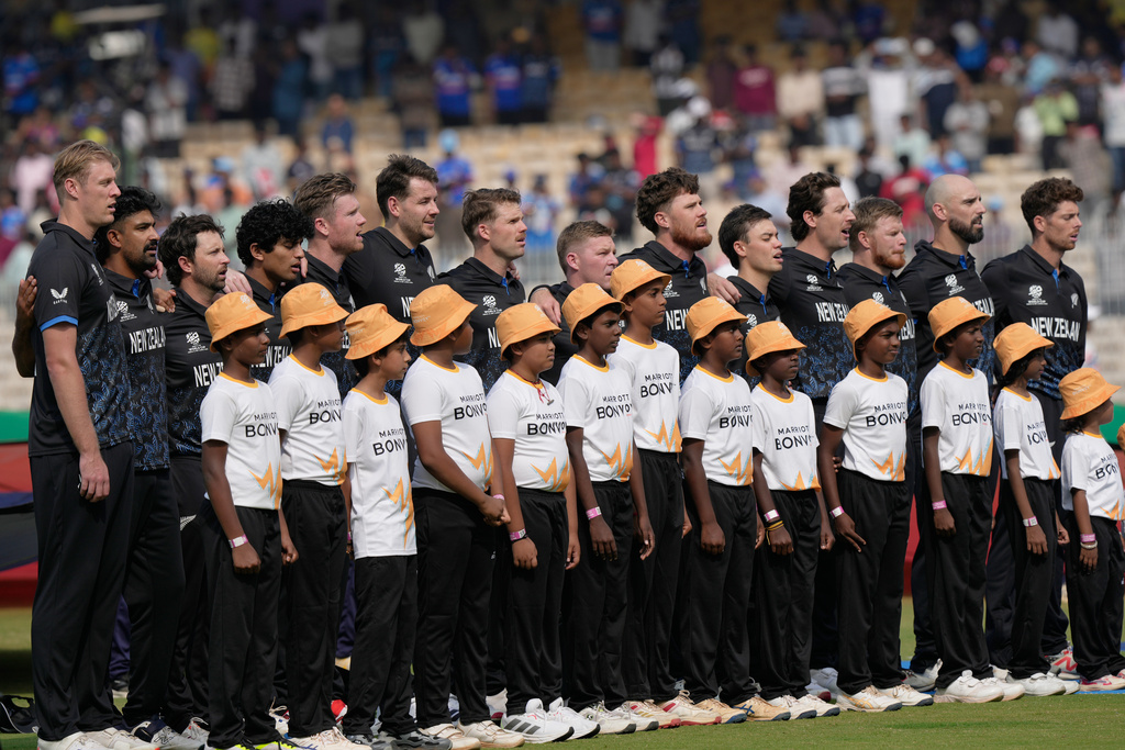 New Zealand's players stand up for the national anthems before the start of the during the T20 World Cup cricket match between New Zealand and United Arab Emirates in Chennai, India, Tuesday, Feb. 10, 2026. (AP Photo/Mahesh Kumar A.)