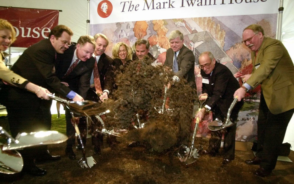 FILE - Dignitaries, from second-from-left to right are Hartford Mayor Eddie Perez; Twain House Board of Trustees President James R. Claffee; Executive Director John Boyer; Connecticut first lady Patty Rowland; Gov. John G. Rowland; U.S. Rep. John Larson; and architect Robert A.M. Stern take part in groundbreaking for an Education and Visitors Center on the grounds of the Mark Twain House in Hartford, Conn., Wednesday, April 3, 2002. (AP Photo/Bob Child, File)