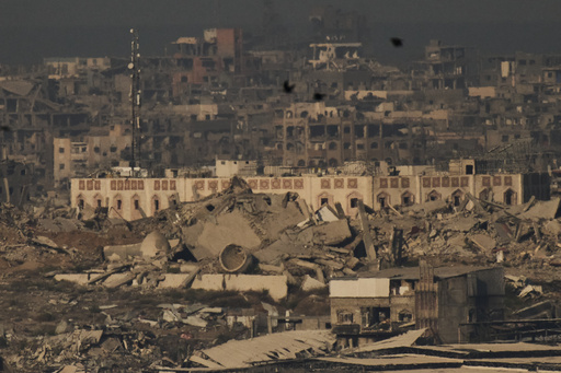 Buildings that were destroyed during the Israeli ground and air operations stand in the northern Gaza Strip during the sunrise, as seen from southern Israel, Friday, Oct. 17, 2025. (AP Photo/Leo Correa) Buildings that were destroyed during the Israeli ground and air operations stand in the northern Gaza Strip during the sunrise, as seen from southern Israel, Friday, Oct. 17, 2025. (AP Photo/Leo Correa)