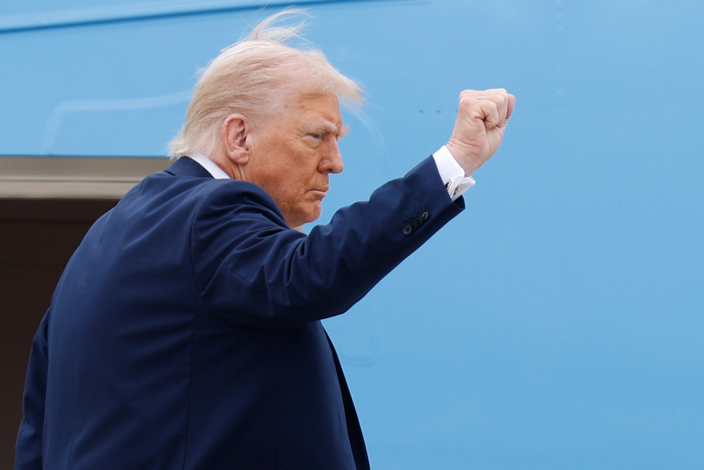 President Donald Trump gestures as he boards Air Force One at Joint Base Andrews, Md., Sunday, Sept. 21, 2025. en route to a memorial for conservative activist Charlie Kirk in Glendale, Ariz. (AP Photo/Luis M. Alvarez)