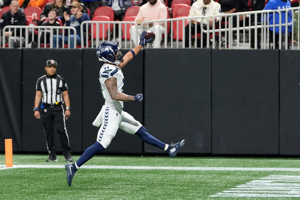 Seattle Seahawks wide receiver Jaxon Smith-Njigba reacts after scoring a touchdown against the Atlanta Falcons during the second half of an NFL football game, Sunday, Dec. 7, 2025, in Atlanta. (AP Photo/Brynn Anderson)
