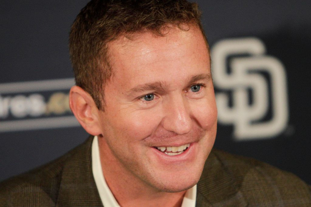 FILE - San Diego Padres general manager Josh Byrnes smiles during a baseball news conference Monday, Oct. 31, 2011 in San Diego. (AP Photo/Lenny Ignelzi)