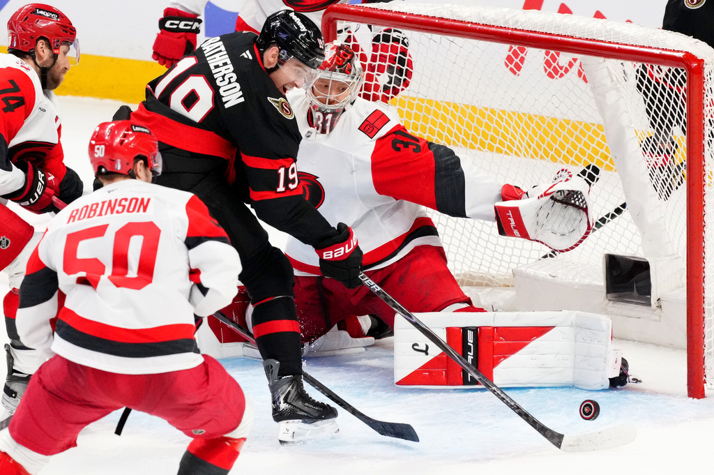 Ottawa Senators right wing Drake Batherson (19) fails to get the puck past Carolina Hurricanes goaltender Frederik Andersen (31) during the third period of Game 4 in a first-round NHL hockey Stanley Cup playoff series in Ottawa, Ontario, Saturday, April 25, 2026. (Sean Kilpatrick/The Canadian Press via AP)