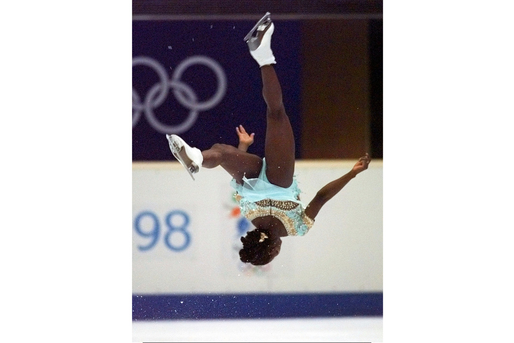 FILE - France's Surya Bonaly performs a back flip during her free skate program Feb. 20, 1998, in Nagano, Japan. (AP Photo/Eric Draper, File)