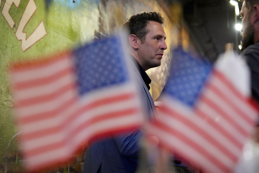 Zach Lahn, Republican candidate for Iowa governor, speaks to local residents during a meet and greet, Tuesday, Aug. 4, 2026, in Hampton, Iowa. (AP Photo/Charlie Neibergall)